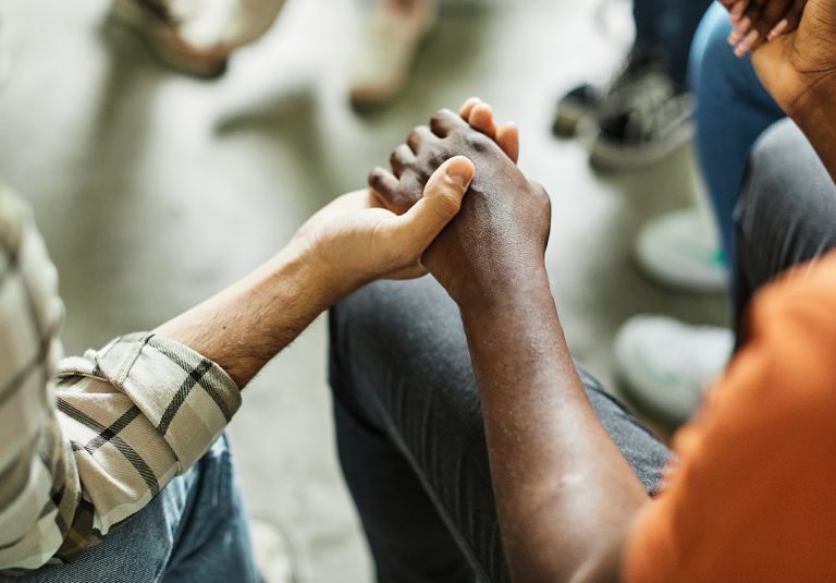 psychotherapy meeting woman support group man therapy psychology hand care closeup holding concept togetherness love hold